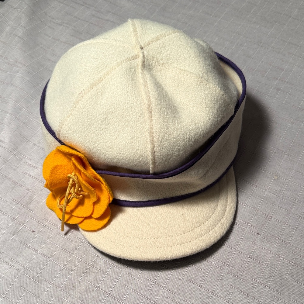 Chic Cream Women's Hat with Yellow Floral Accent and Purple Piping